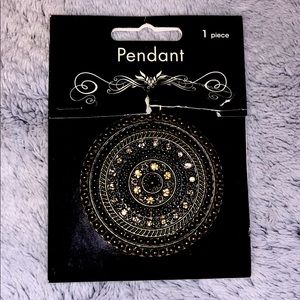 Gold and black pendant, black necklace included